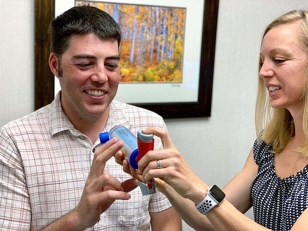 Patient receiving inhaler instructions at Allergy and Asthma Center of Western Colorado in Grand Junction, Colorado.